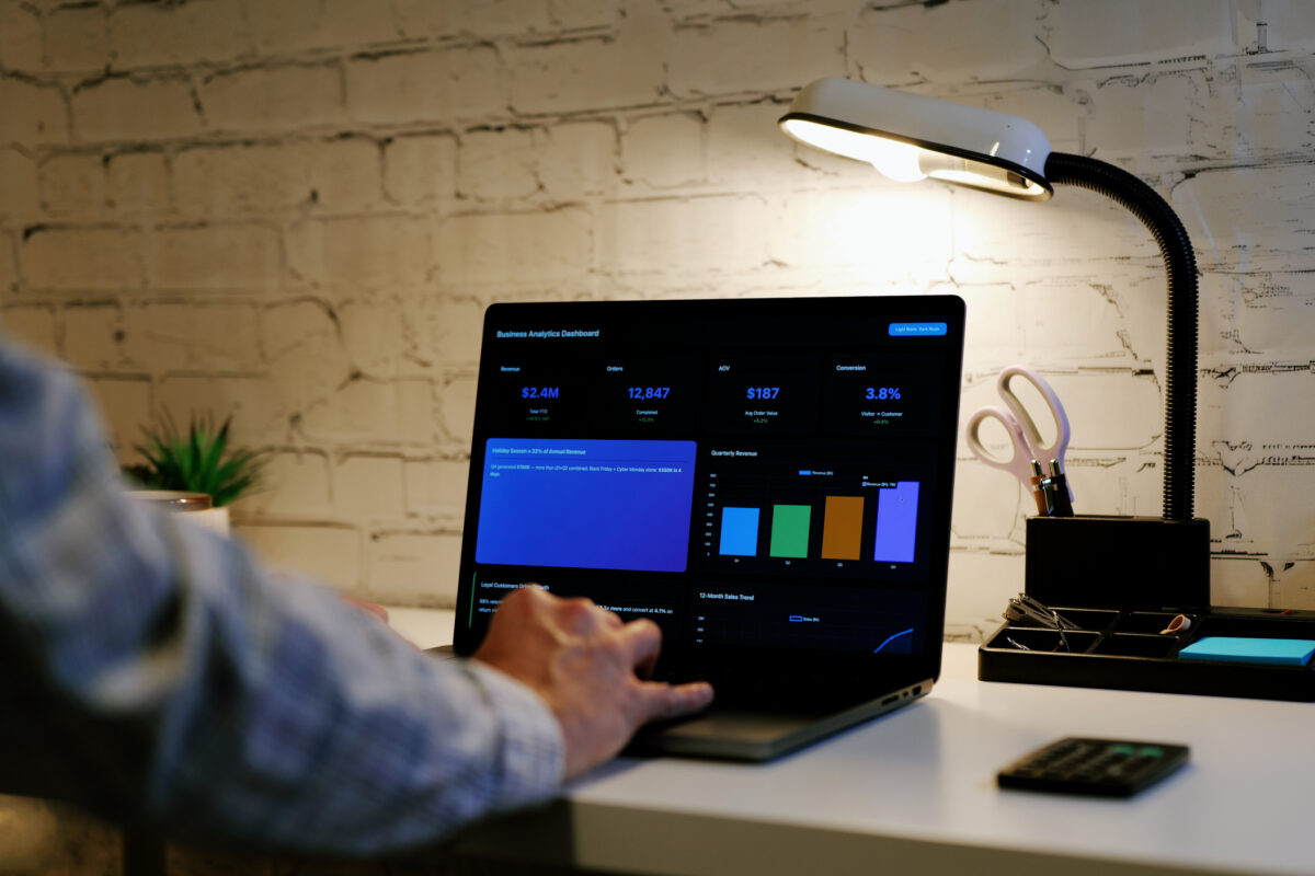Man Viewing Annual Business Analytics Dashboard
